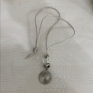 Silver necklace worn couple off times